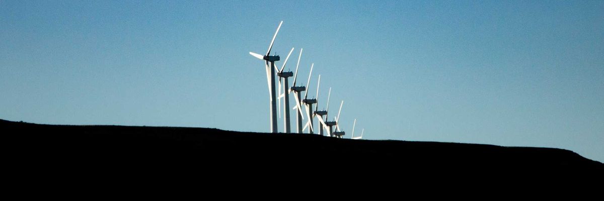 wind turbines under blue sky during daytime