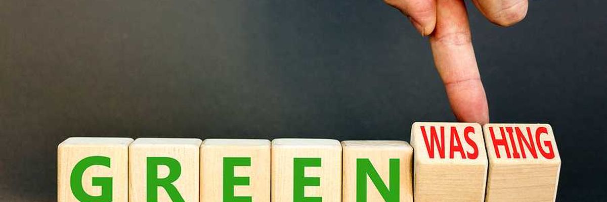 Wooden cubes with the word GREENWASHING on them.