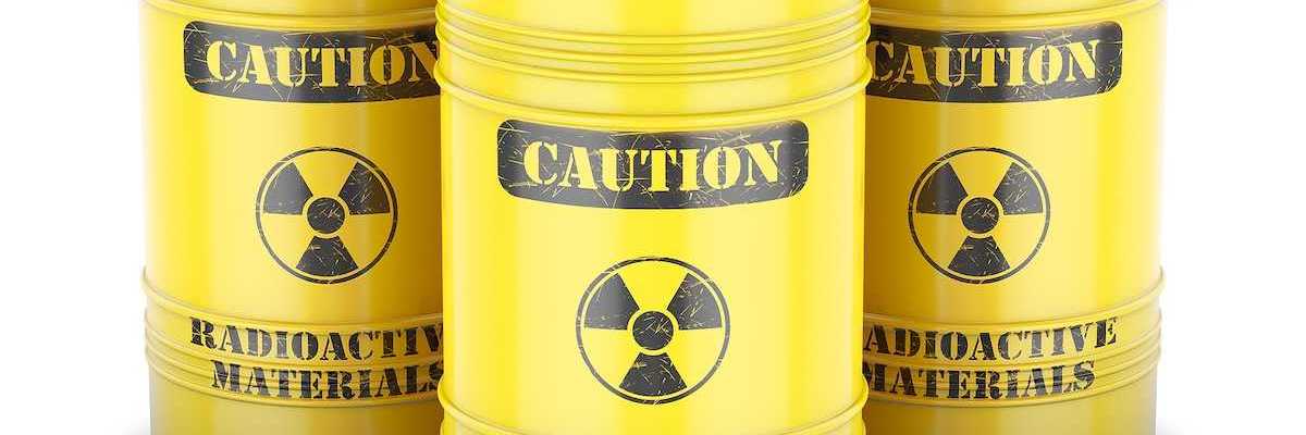 Yellow barrels labeled "CAUTION Radioactive Materials" in black letters