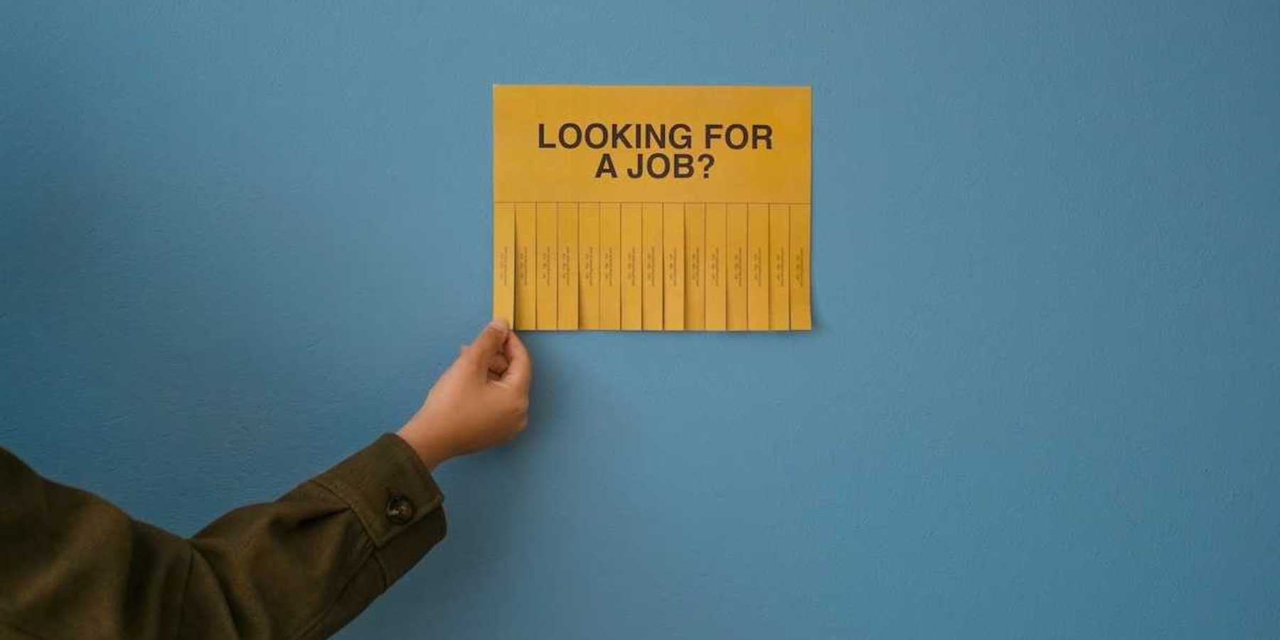 Yellow job posting "LOOKING FOR A JOB?" with tear-off phone number strips
