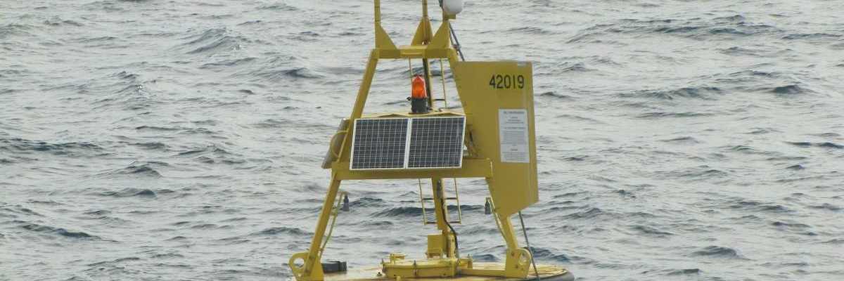 Yellow meteorological buoy floating in the western Gulf of Mexico