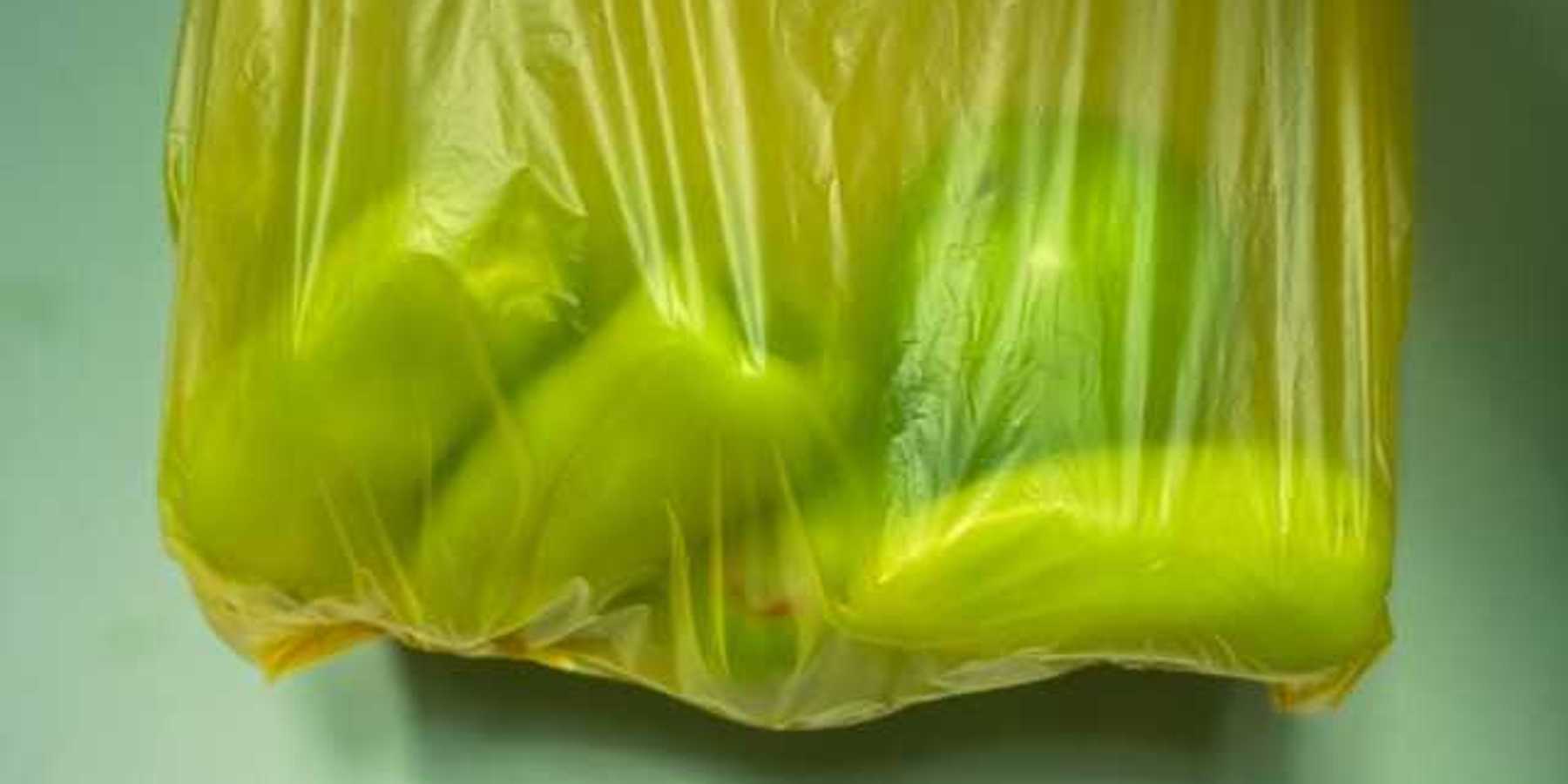 Yellow plastic bag with fruit in it
