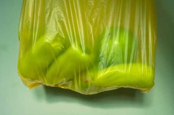 Yellow plastic bag with fruit in it