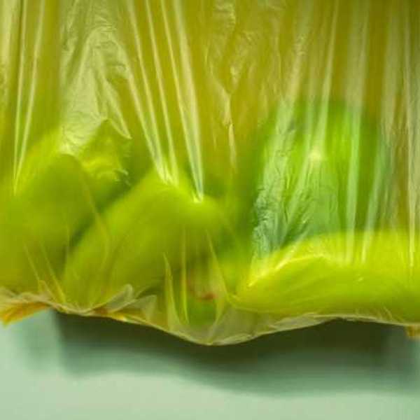 Yellow plastic bag with fruit in it